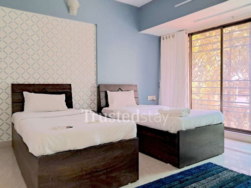Bedroom one of TrustedStay Moksh Service Apartment in Malad East, Mumbai